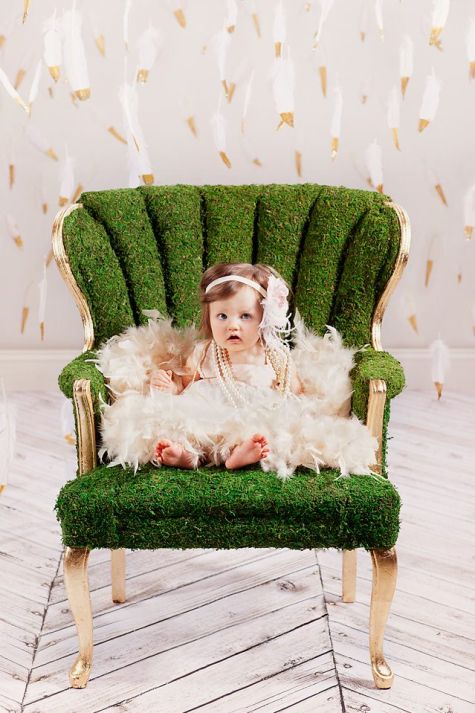 Bo-ho baby in moss-covered chair